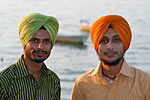 Indian fashion. Two sikh boys  in bright colored turbans and shirts, in Bhopal. They supposedly never cut their hair.